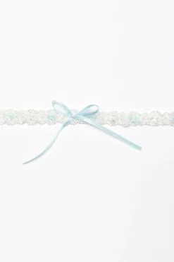 Strumpfband mit blauer Schleife und kleinem Strass-Stein><noscript><img width=